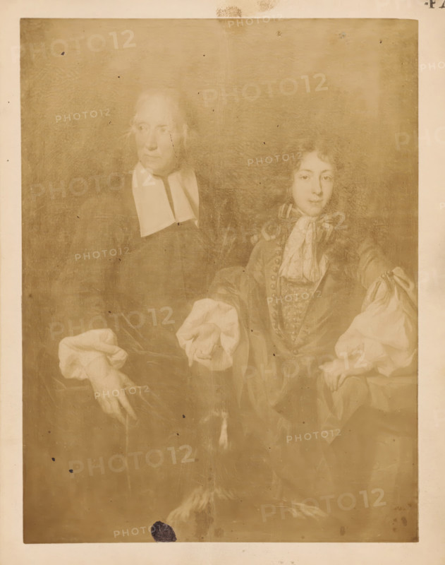 Photographic reproduction of a painting of a portrait of Louis, Dauphin of France and his son Louis of France by Nicolas de Largillière, photograph, reproduction, page, number: '47', after painting by Nicolas de Largillière, c. 1882 - in or before 1887, photographer, paper, albumen print, height 120 mm x width 102 mm, Person, Louis of France (Duke of Burgundy), Dauphin of France Louis, historical persons, aristocracy, 'Aristocratia' (Ripa), A faded sepia portrait of two seated figures within a rectangular frame, one older person on the left wearing a dark garment with a white clerical collar and loose sleeve cuffs, and a younger person on the right wearing a detailed jacket with decorative buttons, a patterned waistcoat, a cravat, and full puffed sleeves, both showing faint facial features and hands positioned in front of them, with visible canvas texture, spots and small blemishes across the surface, a darker smudge near the bottom edge, and a narrow lighter border around the image.