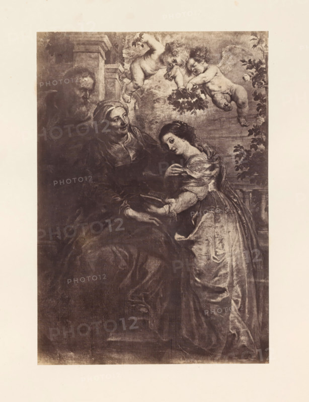 Photo reproduction of the Education of Mary by Peter Paul Rubens, photograph, reproduction, page, photographer: Edmond Fierlants, after painting by Peter Paul Rubens, publisher: C. Muquardt, Brussels, c. 1856 - in or before c. 1861, paper, albumen print, albumendruk, height 361 mm x width 250 mm, education of Mary, A sepia-toned rectangular artwork shows three human figures and two winged cherubs, with an older seated woman wearing a headscarf and dark draped clothing, a younger standing woman in a light flowing dress leaning toward the older woman and holding an open book, and a partially visible older man behind them; two cherubs hover above holding a garland of leaves, and foliage appears along the right edge, all set against an architectural and cloudy background.