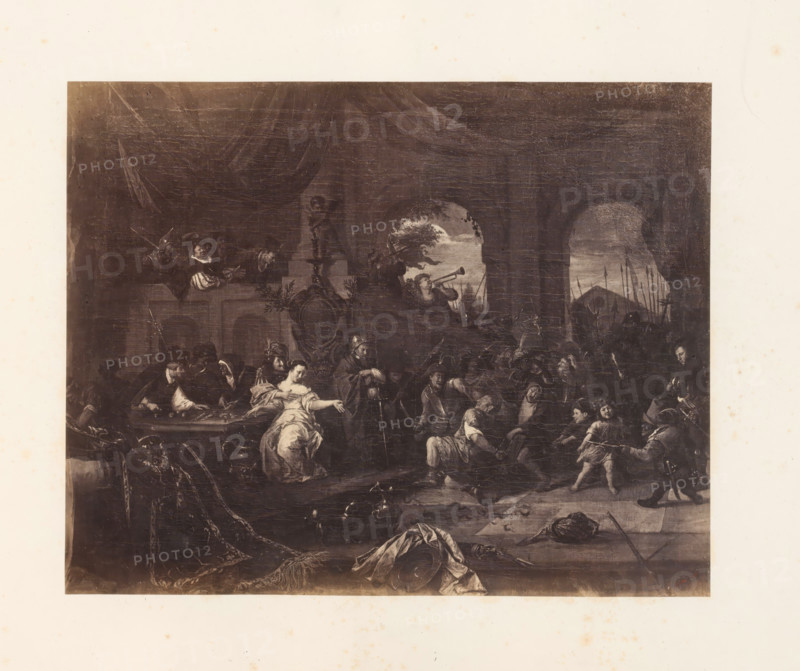 Photo reproduction of Samson insulted by the Philistines by Jan Havicksz. Steen, photograph, reproduction, page, photographer: Edmond Fierlants, after painting by Jan Havicksz. Steen, publisher: C. Muquardt, Brussels, c. 1856 - in or before c. 1861, paper, albumen print, albumendruk, height 281 mm x width 354 mm, Samson in conflict with the Philistines (Judges 15:1-8), A large tonal print of an interior scene depicting many figures gathered around a long table beneath a high vaulted ceiling, with arched openings showing an exterior landscape, musicians playing brass instruments, and seated and standing people in period clothing; a reclining woman in a light dress appears near the center foreground, soldiers or armed men with spears are visible through an arch at the rear, decorative architectural elements and a sculpted bust occupy the upper central area, and draped fabrics, scattered objects, and a fallen banner lie across the floor in the lower foreground.
