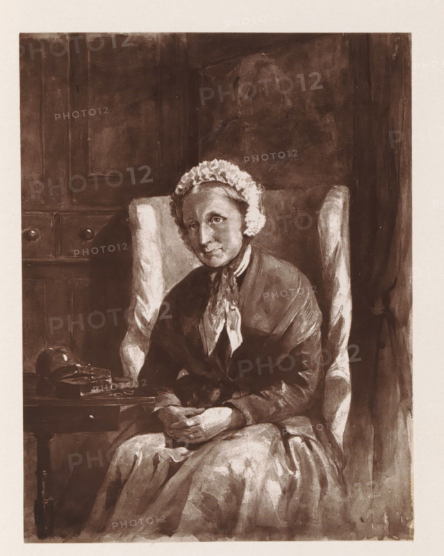 Photo reproduction of a painting depicting a portrait of Mary Lea Gidman, reproduction, page, photomechanical print, cliché maker: Woodbury Permanent Photographic Printing Company, after painting by Mary Grove, c. 1866 - in or before 1876, photographer, paper, Woodburytype, height 113 mm x width 87 mm, Drawing made in 1858., Person, Mary Lea Gidman, historical persons - BB - woman, An older woman wearing a dark dress and a light frilled cap sits in a high-backed upholstered chair, hands folded in her lap; she has a contemplative facial expression and a scarf tied at her neck. The chair shows patterned armrests and light highlights. To her side is a small table with a rounded object and a closed book or box on it. Behind her is a paneled wall with subtle shading and a curtain or drapery at the edge. The image has a monochrome, sepia-toned appearance and visible brush or wash textures throughout.