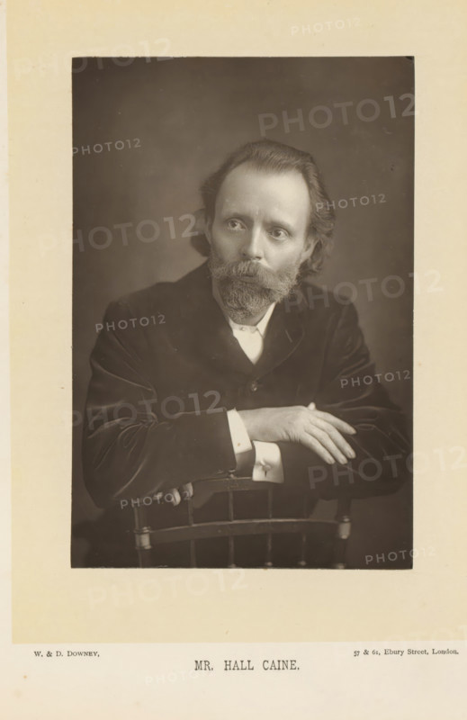 Portrait of Hall Caine, Mr. Hall Caine, page, photomechanical print, inscription: '57 & 61, Elbury Street, London.', photographer: Downey, William & Daniel, London, cliché maker: anonymous, c. 1882 - in or before 1892, paper, Woodburytype, height 140 mm x width 93 mm, Person, Hall Caine, portrait of a writer, A sepia portrait of a man seated behind the back of a wooden chair, shown from the torso upward, wearing a dark jacket and a light shirt with visible cuffs, his hands resting on the top of the chair with fingers relaxed, a full beard and mustache, shoulder-length hair swept back, and a neutral facial expression as he gazes slightly away from the camera, set against a plain dark background and surrounded by a lighter matte border.