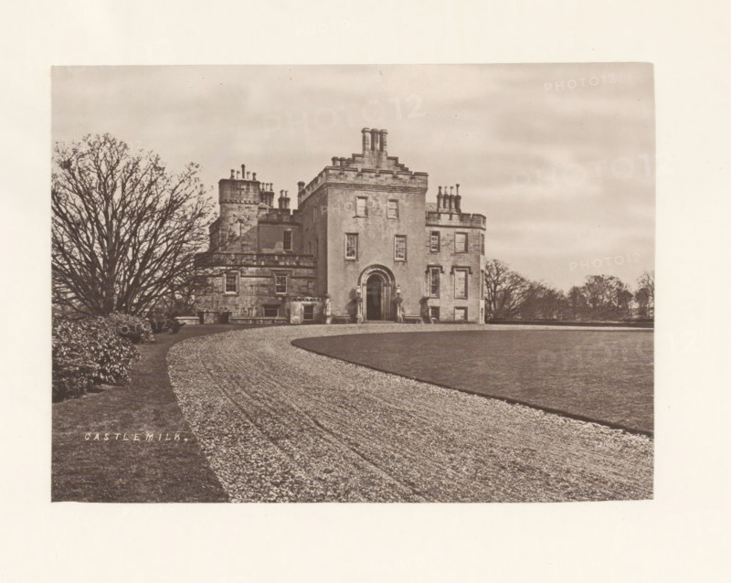 Castlemilk, photograph, page, photographer: Thomas Annan, Glasgow, c. 1868 - in or before 1878, paper, carbon print, height 115 mm x width 160 mm, rural housing, eg country-house, villa, cottage, façade (or house or building), Castlemilk House, A sepia-toned photograph showing a large stone building with a central entrance framed by an arched doorway and rectangular windows, a curved gravel driveway leading toward the entrance, a trimmed lawn adjacent to the driveway, a large bare-branched tree to the left of the building, lower shrubbery near the tree, and a distant line of trees along the horizon under a cloudy sky.