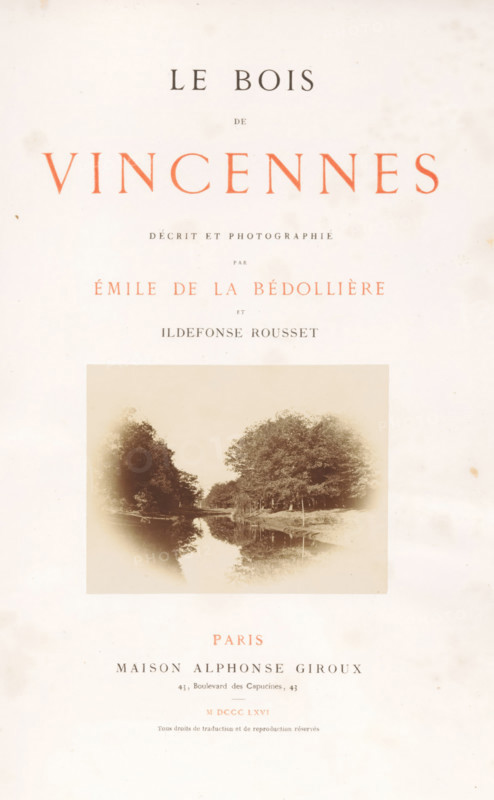 Le bois de Vincennes, book, photographer: Ildefonse Rousset, writer (clerical worker): Émile de La Bédollière, publisher: Alphonse Giroux, Paris, 1866, writer (clerical worker), textile materials, pasteboard, paper, linen (material), printing, albumen print, color on cut, lithography, height 310 mm x width 244 mm x thickness 30 mm, A faded book title page with large serif lettering across the top, a centered vintage photographic image of a tree-lined river or canal with reflections in the water, and several lines of smaller serif text above and below the photograph.