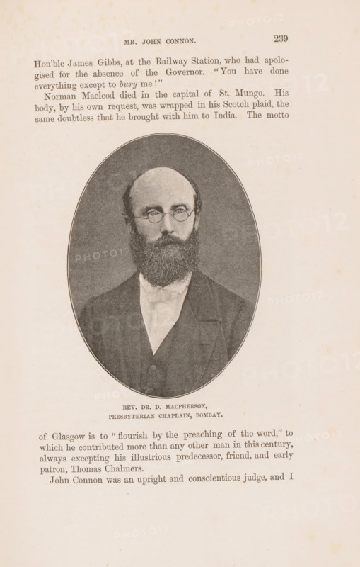 Portrait of Duncan Macpherson, page, photomechanical print, caption: 'REV. DR. D. MACPHERSON, PRESBYTERIAN CHAPLAIN, BOMBAY.', cliché maker: Lemercier & Cie., Paris, c. 1883 - in or before 1893, photographer, paper, autotypie, height 101 mm x width 74 mm, Person, Duncan MacPherson, functionaries and dignitaries, Protestant churches, A sepia-toned page from a book showing an oval portrait of a bearded man wearing round glasses and formal dark clothing with a high white collar, centered on the page; above and below the portrait are blocks of printed text, and the page shows aged paper with small spotting and a narrow dark border around the oval image.