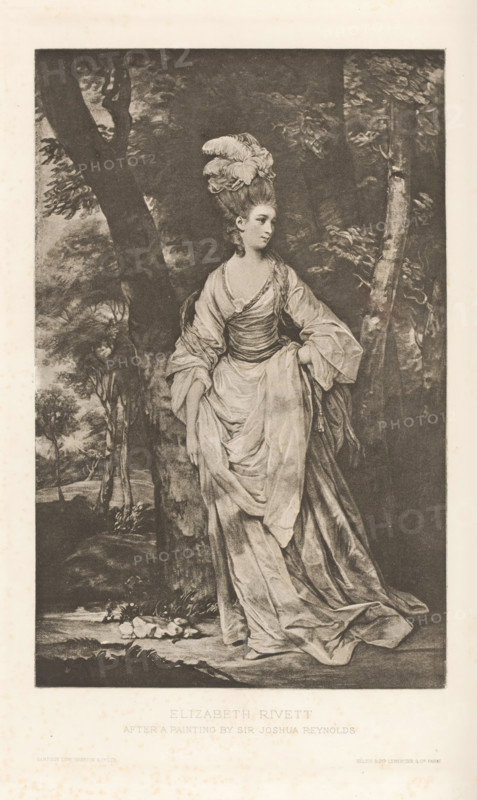 Elizabeth Rivett, reproduction, page, photomechanical print, cliché maker: Lemercier & Cie., Paris, after painting by Joshua Reynolds, c. 1883 - in or before 1893, photographer, paper, photoaquatint, height 177 mm x width 114 mm, Person, Elizabeth Carnac, adult woman, A monochrome print of a woman standing outdoors beside a large tree, wearing an elaborate gown with voluminous drapery and a fitted bodice, her hand holding up part of the skirt while the other rests at her side; she has an updo hairstyle topped with large decorative feathers and looks slightly to the side. The background shows leafy trees and foliage, a shaded forested scene with trunks and branches framing the figure, and a ground area with rocks and plants near her feet. The image is set within a rectangular border and surrounded by a pale margin.