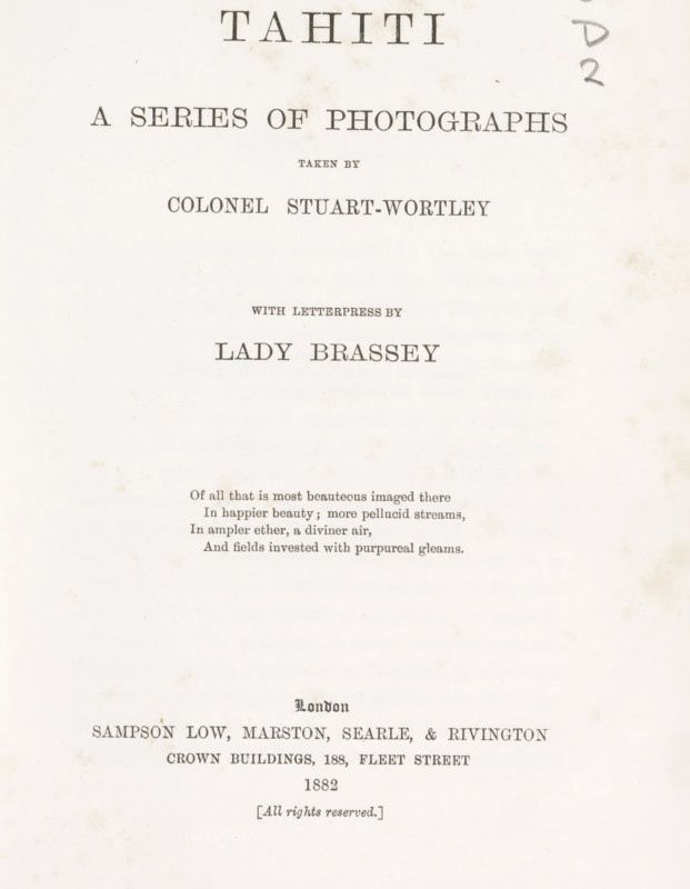 Tahiti. A Series of Photographs taken by Colonel Stuart-Wortley, book, inscription: 'To William smith With best wishes from the author Lady Brassey July 1883.', name: 'Bound by Burn & Co', photographer: Henry Stuart-Wortley, writer (clerical worker): Anna Brassey, publisher: Sampson Low, Marston, Searle, & Rivington, London, 1882, writer (clerical worker), paper, collotype, color on cut, decorated paper, height 219 mm x width 168 mm x thickness 20 mm, The image shows a slightly aged, off-white page with small brownish spots and smudges, featuring centered lines of printed text in various serif fonts and sizes; there is a vertical column of handwritten pencil marks near the top right edge, faint decorative marks along the page, and a block of smaller printed lines near the middle-lower area, with wider blank space toward the lower half.