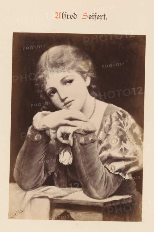 Photo reproduction of a painting by Alfred Seifert, depicting a portrait of a woman with a rose in her hand, Alfred Seifert, photograph, reproduction, page, photographer: Franz Hanfstaengl (possibly), Munich, c. 1875 - c. 1885, Bavaria, paper, albumen print, height 135 mm x width 96 mm, Photo on page 24., picture, painting, adult woman, flowers: rose, A monochrome portrait of a young woman leaning on folded hands with her chin resting on them, wearing a patterned dress with puffed sleeves and a beaded necklace, her hair short and wavy, eyes gazing slightly to the side and a small flower pinned near her wrist, set against a dark rectangular background on a lighter page.