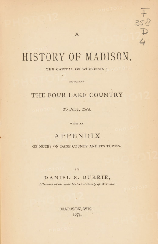 A history of Madison, the capital of Wisconsin, including the four lake country to July, 1874 : with an appendix of notes on Dane county and its town, book, name: 'WG Dooi...', writer (clerical worker): Daniel S. Durrie, writer (clerical worker), textile materials, pasteboard, paper, linen (material), albumen print, height 231 mm x width 160 mm x thickness 33 mm, A cream-colored aged book page with centered printed lines of dark serif type arranged in a title layout, featuring a large bold heading near the top, several smaller headings and subheadings stacked below it, wide margins, a light speckled paper texture, and a vertical handwritten notation in pencil along the right edge.