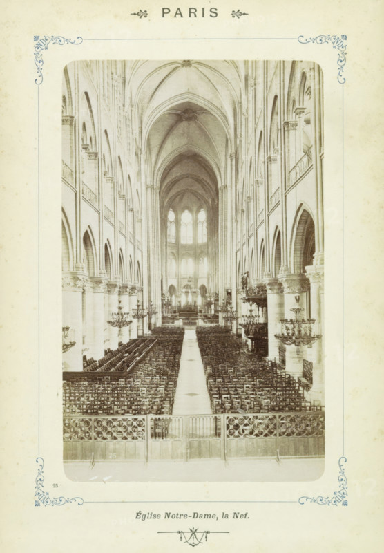 Central nave of Notre-Dame in Paris, Paris - Église Notre-Dame, la Nef, photograph, Part of Photo album with sights in Paris, Versailles and the Bois de Boulogne., number: '25', Paris, c. 1900, photographer, pasteboard, paper, albumen print, albumendruk, height 155 mm x width 97 mm, parts of church interior: nave, Notre-Dame (Paris), A sepia-toned interior photograph of a large Gothic cathedral nave viewed from the rear toward the altar, showing tall pointed ribbed vaults and a long central aisle flanked by many rows of wooden chairs, high arcaded side aisles with clustered columns and ornate capitals, elevated balconies along the upper aisles, large arched windows at the far end admitting light, multiple decorative chandeliers suspended along the nave, carved stone screens and railings at the foreground, and symmetrical architectural details lining both sides of the central space.