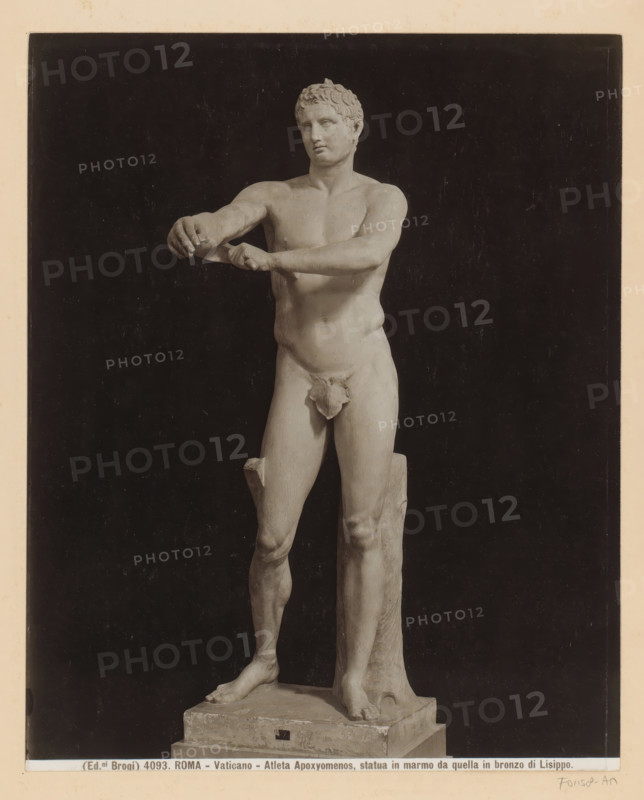 Sculpture of Apoxyomenos in the Museo Pio-Clementino in Vatican City, Rome - Vaticano - Atleta Apoxyomenos, statua in marmo da quella in bronzo di Lisippo, photograph, Part of Photo album with photographs of landmarks and artworks in Italy., number: '4093', photographer: Edizioni Brogi, Vatican Museums, c. 1875 - in or before 1907, Vatican City, paper, gelatin silver print, height 247 mm x width 200 mm, sculpture, man (showing himself) undressed, quasi-nude, A photograph of a marble statue of a nude male figure standing on a rectangular plinth against a dark background, the figure shown from head to feet with short curly hair and a neutral facial expression, the torso and limbs rendered with visible muscle and anatomical detail, one arm extended forward with the hands positioned as if holding or manipulating an object, the legs supporting the weight with one knee slightly bent and a vertical support behind one thigh, the base showing wear and small chips, and a pale border surrounding ...