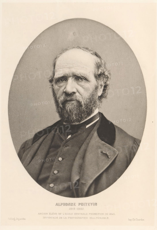 Alphonse Poitevin 1819-1882, Portrait of Alphonse Poitevin, page, photomechanical print, inscription: 'Ancien élève de l'Ecole Centrale promotion de 1843, inventeur de la photographie inaltérable.', cliché maker: Paul Dujardin, printer (person): Charles Chardon aîné, Paris, c. 1877 - in or before 1882, Paul Dujardin, Charles Chardon aîné, photographer, cliché maker, printer (person), paper, photoaquatint, height 168 mm x width 119 mm, Print on unnumbered page., Person, Alphonse-Louis Poitevin, historical persons, portrait, self-portrait of photographer, A monochrome oval portrait of an older man shown from the chest up, with a full beard and mustache, receding hairline with wavy hair at the sides, and deep-set eyes looking straight ahead; he wears a dark coat with a high-collared shirt and a vest with visible buttons, and a small pin or decoration on one lapel; the oval portrait is set against a light rectangular background.