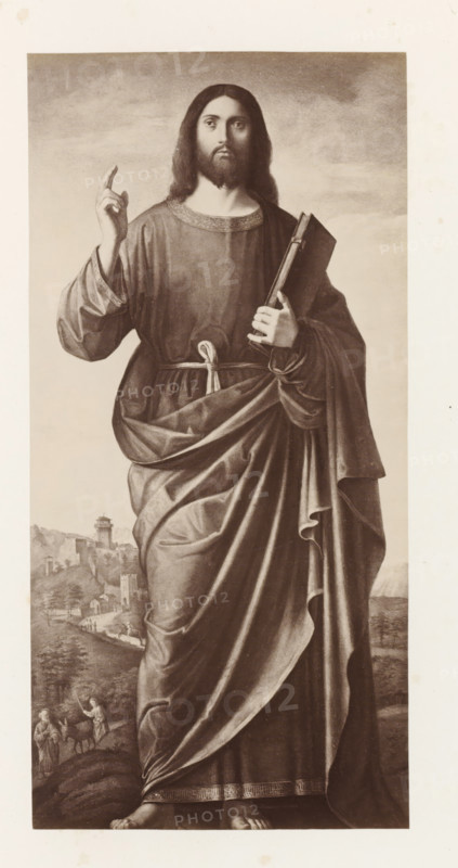 Photo reproduction of the painting The Blessing Christ by Cima da Conegliano, Cima da Conegliano: Christ, photograph, reproduction, page, after painting by Giovanni Battista Cima da Conegliano, publisher: Photographische Gesellschaft Berlin, Berlin, c. 1870 - in or before 1875, photographer, paper, albumen print, height 244 mm x width 119 mm, Photo on unnumbered page., 'Pantocrator', (bust of) Christ, making a speaking or blessing gesture and holding a book, A full-length monochrome depiction of a robed figure standing on a landscape background, the figure facing forward with long hair and a beard, wearing a long flowing garment tied at the waist and detailed with patterned trim at the neckline and hem, one hand raised with two fingers extended and the other hand holding a closed book close to the chest; the drapery of the robe shows deep folds and sweeping lines down to bare feet visible at the bottom, while the background shows a distant hilly landscape with small buildings, a tower,...