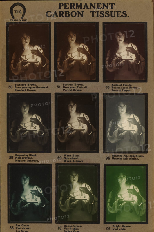 Nine portraits of an unknown woman with a candle, photograph, Sample card with 9 differently displayed carbon prints., inscription: '70. Red Chalk. 93. Engraving Red Chalk. 83. Terra Cotta. 75. Sepia Ordinary. 76. Willesden Sepia. 77. Warm Sepia. 78. Cool Sepia. 80.Golden Sepia. 90. Greenish Sepia.', publisher: T. Illingworth (possibly), c. 1910, photographer, paper, pasteboard, carbon print, height 248 mm x width 160 mm, adult woman, candle, A vertical sheet displays a grid of photographic portrait samples each framed by a narrow dark border, showing the same young woman holding a plate with a small light source; she wears a loose, light-colored blouse with full sleeves and a decorative neckline, and a long pendant hangs from her neck. The woman appears in various overall color tones across the frames, with subtle shifts in warmth and hue while her pose and facial expression remain similar; in some frames the lighting on her face and hands is brighter and warmer, in others it is coole...
