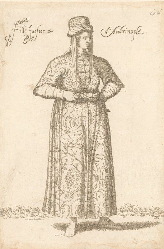 Jewish girl from Andrinople or Edirne in Thrace, Fille juifve d'Andrinople, print, album page, book illustration, Print is part of an album., printmaker: Léon Davet, after drawing by Luca Penni (attributed to), after drawing by Nicolas de Nicolay (possibly), publisher: Guillaume Rouille (I), Lyon, 1555 - 1568, Léon Davent, Luca Penni, Nicolas de Nicolay, Guillaume Rouille (I), printmaker, publisher, Attributed to, paper, etching, pasted on album page, height 260 mm x width 174 mm, A standing figure in a long patterned robe with floral and ornamental designs, wearing a tall headdress with draped fabric and a fitted, buttoned bodice, hands clasped at the waist, long sleeves with fitted cuffs, visible shoes peeking from beneath the hem, finely hatched shading and crosshatching throughout the garment and background, simple ground with short grass and shadowing beneath the figure.