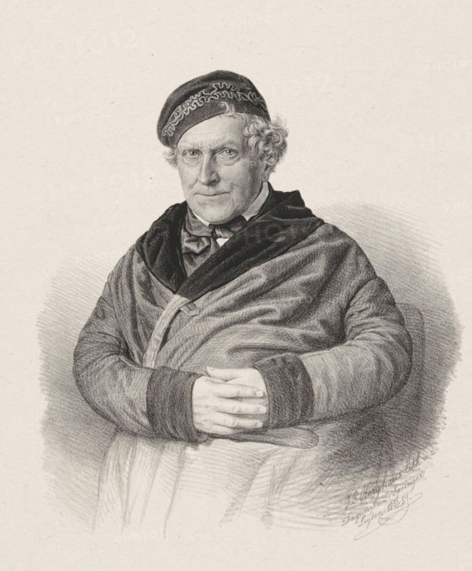 Portrait of an unknown man, print, The sitter is sitting on a chair with his hands clasped in front of his stomach. He is wearing a coat and a cap with a decorated brim., inscription: 'Uncle Gerrit', printmaker: Johann Peter Berghaus, Leiden, after photo by Leendert Springer (I), 1851-07-26, Leendert Springer (I), paper, chine collé, lithography, lithography on chine collé, height 485 mm x width 352 mm, historical persons, head-gear: cap, A black and white pencil or charcoal portrait of an older person shown from the waist up seated with hands folded over the stomach, wearing a patterned cap and a dark draped garment over lighter clothing, with curly hair visible at the sides of the head, a composed facial expression, and detailed shading creating texture in the fabric and background.