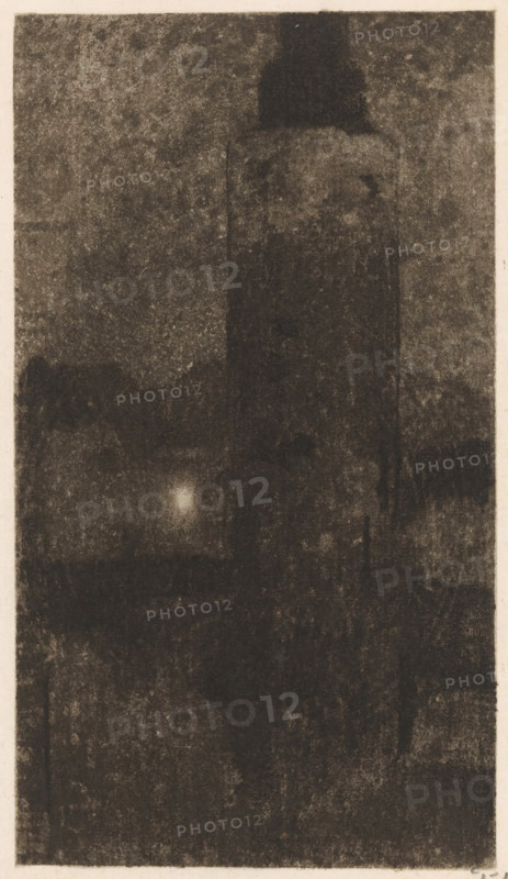 Montelbaan Tower at evening in Amsterdam, print, signature: 'Witsen', printmaker: Willem Witsen (signed by artist), Amsterdam, c. 1887 - c. 1888, paper, soft-ground etching, intaglio printmaking technique, aquatint, height 274 mm x width 136 mm, tower, clock tower, monumental adornment, Montelbaan Tower, A tall, dark, rectangular tower with a rounded top dominates the center of a grainy, monochrome scene, surrounded by indistinct, shadowy shapes and textured darkness; a soft, diffuse light spot appears lower left of center, and the image is framed by a narrow, lighter border.