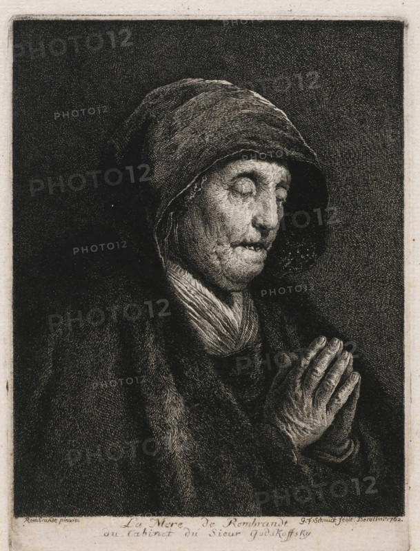 Portrait of Neeltje Willemsdr. Zuytbrouck praying, print, printmaker: Georg Friedrich Schmidt, Berlin, after painting by Rembrandt van Rijn, 1762, paper, etching, intaglio printmaking technique, height 150 mm x width 100 mm, Person, Neeltje Willemsdr. Zuytbrouck, historical persons - BB - woman, A monochrome etching shows a close-up of an elderly person wearing a hooded cloak, eyes closed and head slightly bowed, with a lined face and closed mouth. The hood covers the head and casts shadow around the face, and a scarf or cloth is visible around the neck. Hands are held together in front of the chest in a praying or clasped position, with detailed wrinkles and textured skin. The background is dark and densely hatched, framing the figure, and the image is bordered by a lighter margin.