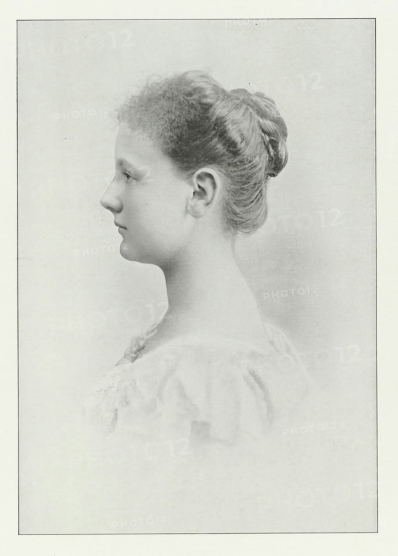 Portrait of Wilhelmina, Queen of the Netherlands, photomechanical print, Portrait of Wilhelmina. In the lower margin her name and title., photographer: Adolphe Zimmermans, cliché maker: anonymous, Netherlands, publisher: Maarten van der Beek, The Hague, 1898, paper, autotype, height 505 mm x width 355 mm, The title mentioned here refers to the highest title obtained by the sitter, not necessarily to the title the sitter bears in this image., Person, Wilhelmina of the Netherlands, A grayscale portrait of a young person shown in profile facing left, with hair pulled back into a smooth bun and short curly bangs at the forehead, a visible ear, a straight nose, closed lips, and a long neck; the subject wears a light, textured garment with soft folds and the background is plain and softly shaded.