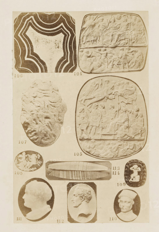 Ten reliefs and portraits in profile, photograph, page, photographer: F. Cole, c. 1857 - in or before 1867, paper, albumen print, height 165 mm x width 101 mm, gem, gemstone, sculpture (relief, sculpture), carving, applied arts, A vertical sheet showing a grid of carved and molded objects photographed in sepia tones, including ornate oval and rounded relief plaques with crowded figurative scenes, a wavy multi-banded abstract pattern, a rough textured oval stone, small circular and oval cameos with profiles and figures, a long rectangular carved slab with parallel grooves, and an oval medallion with a three-dimensional reclining or seated figure, all arranged with small numeric labels beneath each item.