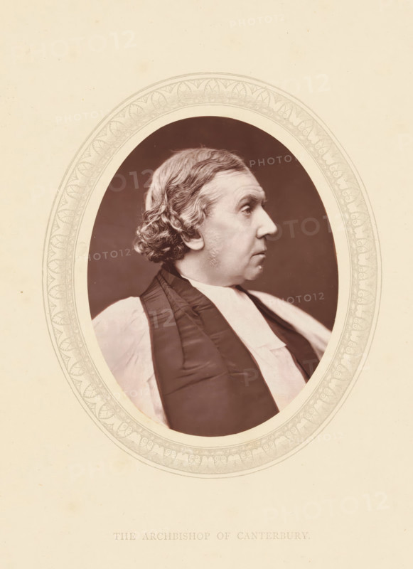 The archbishop of Canterbury, page, photomechanical print, photographer: Lock & Whitfield, cliché maker: anonymous, c. 1871 - in or before 1876, paper, Woodburytype, Woodbury Process, height 115 mm x width 89 mm, Person, Archibald Tait, archbishop, bishop, etc. (Roman Catholic), historical persons (portraits and scenes from the life) ((full) bust portrait), A sepia portrait of a man shown in profile facing right within an ornate oval frame, with short wavy hair and sideburns, a high forehead, a prominent nose, and a composed expression; he wears clerical robes with a dark stole over a lighter garment, and the oval opening reveals a dark background behind his head while the surrounding paper is light with decorative border details.