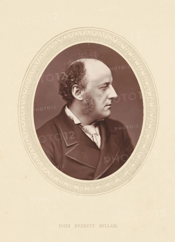John Everett Millais, page, photomechanical print, photographer: Lock & Whitfield, cliché maker: anonymous, c. 1871 - in or before 1876, paper, Woodburytype, Woodburytypie, height 115 mm x width 89 mm, Person, portrait, self-portrait of painter, historical persons (portraits and scenes from the life) ((full) bust portrait), An oval portrait of a middle-aged man in profile facing right, shown from the shoulders up with a high forehead, receding hairline, curly hair at the back of his head, prominent sideburns, and a clean-shaven chin, wearing a dark formal coat with wide lapels and a light-colored cravat, all set against a dark oval background framed by an ornate light decorative border on a pale textured page.