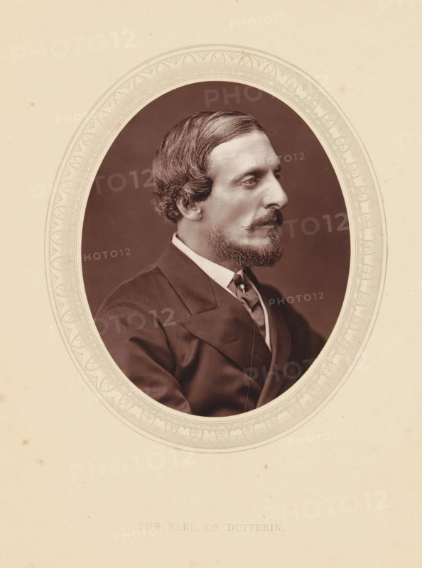 The earl of Dufferin, page, photomechanical print, photographer: Lock & Whitfield, cliché maker: anonymous, c. 1871 - in or before 1876, paper, Woodburytype, height 115 mm x width 89 mm, Person, Frederick Hamilton-Temple-Blackwood (Marquis of Dufferin and Ava), historical persons (portraits and scenes from the life) ((full) bust portrait), An oval sepia portrait of a man shown in profile facing right, set within a decorative oval frame on a pale background; the man has neatly combed dark hair, a trimmed mustache and beard, and is wearing a dark suit jacket with a white shirt collar and a patterned tie, with a neutral expression and a plain dark backdrop behind him.