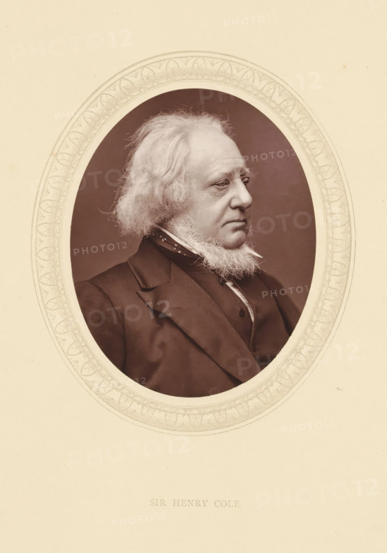 Sir Henry Cole, page, photomechanical print, photographer: Lock & Whitfield, cliché maker: anonymous, c. 1871 - in or before 1876, paper, Woodburytype, Woodbury Process, height 115 mm x width 89 mm, Person, Henry Cole, magistracy, judges, historical persons (portraits and scenes from the life) ((full) bust portrait), An oval portrait of an older man shown in profile facing right, with light-colored wavy hair and a full beard along his jawline, wearing a dark suit jacket, waistcoat, high-collared shirt, and a patterned neck scarf, set against a plain darker background and framed by an ornate decorative oval border on a light-colored mounting.