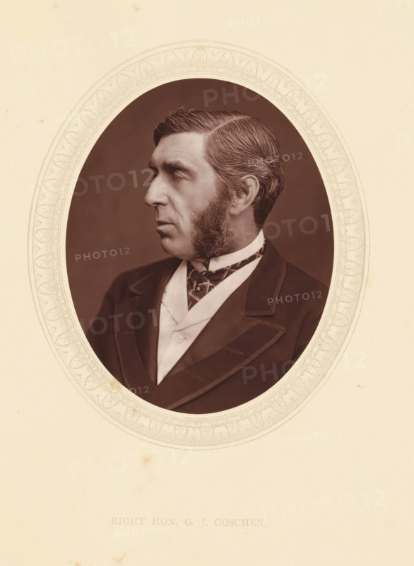 Right hon. GJ Goschen, page, photomechanical print, photographer: Lock & Whitfield, cliché maker: anonymous, c. 1871 - in or before 1876, paper, Woodburytype, Woodbury Process, height 115 mm x width 89 mm, Person, George Goschen, politician, eg party leader, historical persons (portraits and scenes from the life) ((full) bust portrait), A sepia-toned oval portrait of a man shown in profile facing left, with neatly combed hair, prominent sideburns, and a neutral expression, wearing a dark jacket with wide lapels, a light-colored waistcoat, and a patterned necktie, all set against a plain dark background and surrounded by a decorative pale oval mat on a light sheet.