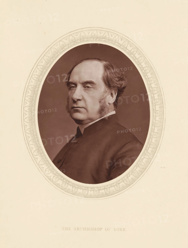 The archbishop of York, page, photomechanical print, photographer: Lock & Whitfield, cliché maker: anonymous, c. 1873 - in or before 1878, paper, Woodburytype, Woodbury Process, height 115 mm x width 89 mm, Person, William Thomson, archbishop, bishop, etc. (Roman Catholic), historical persons (portraits and scenes from the life) ((full) bust portrait), A sepia portrait of a middle-aged man shown from the chest up inside an ornate oval frame, with a neutral backdrop inside the oval and a plain light background outside it, the man facing slightly to his left with a composed expression, sideburns and neatly combed hair, wearing a dark high-collared garment.
