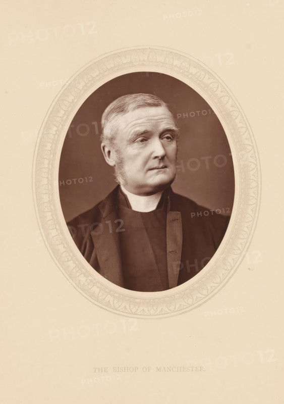 The bishop of Manchester, page, photomechanical print, photographer: Lock & Whitfield, cliché maker: anonymous, c. 1873 - in or before 1878, paper, Woodburytype, Woodbury Process, height 115 mm x width 89 mm, Person, James Fraser, archbishop, bishop, etc. (Roman Catholic), historical persons (portraits and scenes from the life) ((full) bust portrait), An oval sepia-toned portrait of an older man with short combed hair and sideburns, wearing a dark clerical collar and dark jacket, set against a plain background and surrounded by a decorative oval border on a light beige mount.