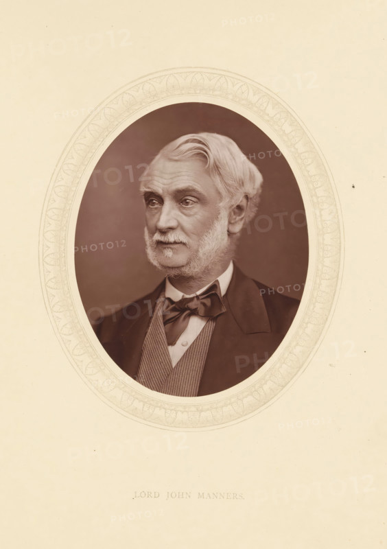 Lord John Manners, page, photomechanical print, photographer: Lock & Whitfield, cliché maker: anonymous, c. 1873 - in or before 1878, paper, Woodburytype, Woodbury Process, height 115 mm x width 89 mm, Person, John Manners (1818-1906), politician, eg party leader, historical persons (portraits and scenes from the life) ((full) bust portrait), An oval sepia portrait of an older man with light hair and sideburns set against a dark background, framed by a decorative oval border on a light beige page; he is shown from the chest up wearing a dark jacket, a waistcoat with a patterned texture, a white shirt, and a tied bow at the collar, his gaze directed slightly to one side and his expression neutral.