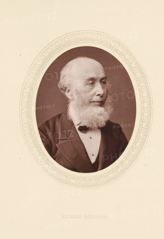 Richard Redgrave, page, photomechanical print, photographer: Lock & Whitfield, cliché maker: anonymous, c. 1873 - in or before 1878, paper, Woodburytype, Woodbury Process, height 115 mm x width 89 mm, Person, portrait, self-portrait of artist, historical persons (portraits and scenes from the life) ((full) bust portrait), An oval sepia portrait of an older man with a full white beard and receding hairline set against a plain darker background, framed by an ornate etched oval border on a cream sheet, showing the man in a dark suit jacket, waistcoat, white shirt, and bow tie, his face turned slightly to one side with visible wrinkles around his eyes and forehead and a calm expression.