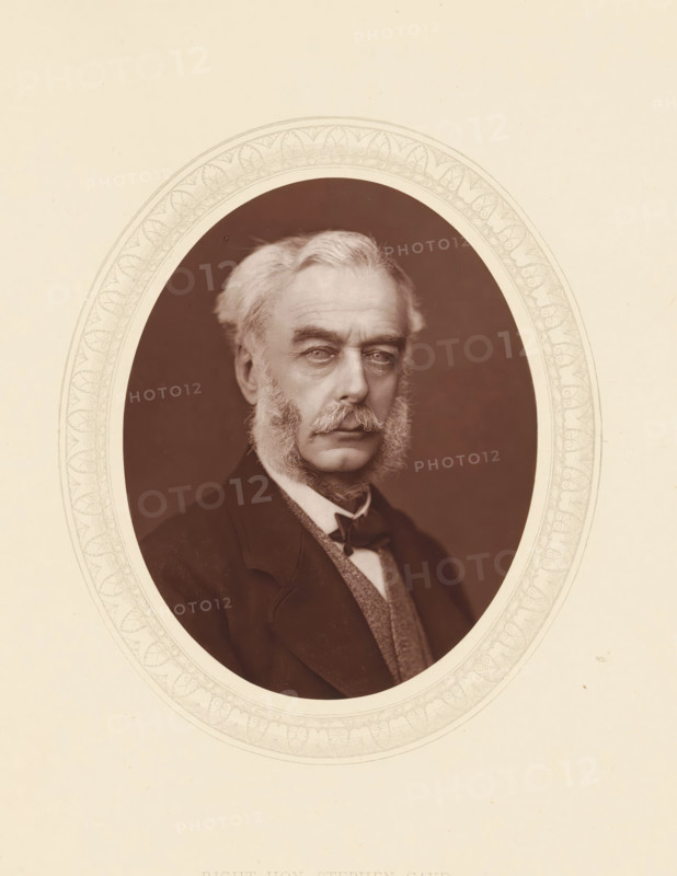 Right hon. Stephen Cave, page, photomechanical print, photographer: Lock & Whitfield, cliché maker: anonymous, c. 1873 - in or before 1878, paper, Woodburytype, Woodbury Process, height 115 mm x width 89 mm, Person, Stephen Cave, lawyer, attorney at law, historical persons (portraits and scenes from the life) ((full) bust portrait), An oval sepia portrait of an older man centered on a light background, showing his head and upper torso framed by a decorative oval border; he has light-colored hair swept back, prominent sideburns and a mustache, a solemn facial expression with visible wrinkles around the eyes and forehead, and he wears a dark jacket over a patterned waistcoat and a light shirt with a cravat.