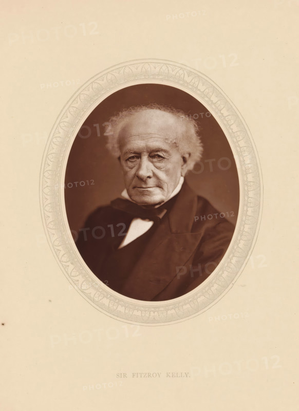 Sir Fitzroy Kelly, page, photomechanical print, photographer: Lock & Whitfield, cliché maker: anonymous, c. 1875 - in or before 1880, paper, Woodburytype, Woodbury Process, height 115 mm x width 89 mm, Person, Fitzroy Kelly, magistracy, judges, historical persons (portraits and scenes from the life) ((full) bust portrait), An oval sepia portrait of an older man with thinning white hair and prominent facial lines set against a dark background, framed by an ornate decorative oval border on a pale background, showing him wearing a dark coat and a white shirt collar with a dark bow at the neck, his expression neutral and his gaze directed forward.