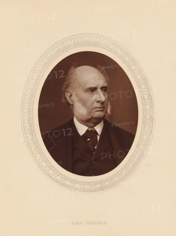 Lord Penzance, page, photomechanical print, photographer: Lock & Whitfield, cliché maker: anonymous, c. 1875 - in or before 1880, paper, Woodburytype, Woodbury Process, height 115 mm x width 89 mm, Person, James Wilde, magistracy, judges, historical persons (portraits and scenes from the life) ((full) bust portrait), An oval sepia portrait of an older man with receding hair and prominent sideburns set against a dark background, the man wearing a dark suit jacket, waistcoat, and a shirt with a visible collar and tie, framed by an ornate oval border on a light beige page.