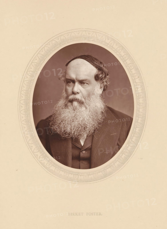 Birket Foster, page, photomechanical print, photographer: Lock & Whitfield, cliché maker: anonymous, c. 1875 - in or before 1880, paper, Woodburytype, Woodbury Process, height 115 mm x width 89 mm, Person, Myles Birket Foster, portrait, self-portrait of painter, historical persons (portraits and scenes from the life) ((full) bust portrait), A sepia-toned oval portrait of an older man with a full long beard and mustache, wearing a dark suit jacket and waistcoat, set against a plain darker background and framed by a decorative oval mat with patterned edging.