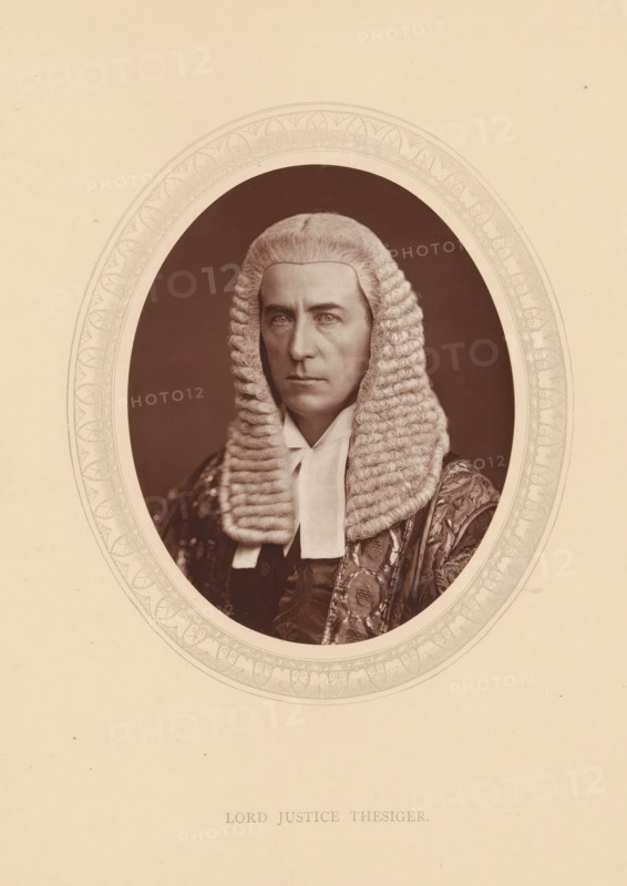 Lord justice Thesiger, page, photomechanical print, photographer: Lock & Whitfield, cliché maker: anonymous, c. 1875 - in or before 1880, paper, Woodburytype, Woodbury Process, height 115 mm x width 89 mm, Person, Alfred Thesiger, magistracy, judges, historical persons (portraits and scenes from the life) ((full) bust portrait), An oval sepia portrait shows a person wearing a full, curled white judicial wig and a dark robe with ornate patterned fabric visible on one shoulder, a white neckband visible at the throat, and a solemn facial expression with light-colored eyes, framed by a decorated oval border on a pale background.