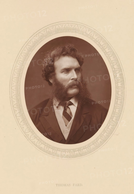 Thomas Faed, page, photomechanical print, photographer: Lock & Whitfield, cliché maker: anonymous, c. 1875 - in or before 1880, paper, Woodburytype, Woodbury Process, height 115 mm x width 89 mm, Person, portrait, self-portrait of painter, historical persons (portraits and scenes from the life) ((full) bust portrait), A sepia-toned oval portrait of a man with curly hair and prominent muttonchop sideburns connected to a thick mustache, shown from the chest upward and turned slightly to his left, wearing a dark jacket over a light shirt and a diagonally striped necktie, all set against a plain dark background and framed by a decorative oval border on a light paper background.