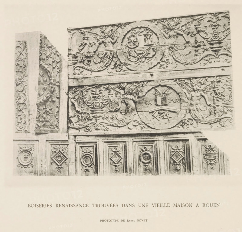 Boiserie Renaissance trouvées dans une vieille maison in Rouen, Paneling of a house in Rouen, page, photomechanical print, number: 'Pl. VIII.', photographer: Raoul Bonet, c. 1885 - in or before 1895, paper, collotype, photoprint, height 175 mm x width 143 mm, paneling, A sepia-toned photograph of an ornate carved wooden panel showing upper decorative frieze and lower paneled doors, with intricate floral scrollwork, circular medallions, and framed diamond-shaped motifs; the frieze features winged female figures in flowing drapery, circular wreaths with emblems, stylized urns and garlands, and symmetrical foliage reliefs, while the doors below display repeating carved panels each with central raised ornamentation surrounded by carved borders and small decorative motifs along vertical divisions.