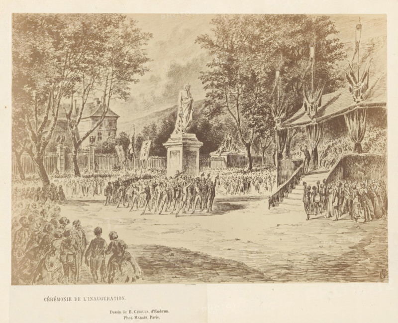 Photo reproduction of a drawing of the unveiling ceremony of the statue of Charles-François de Ladoucette by Jean Marcellin in Gap, Cérémonie de l'Inauguration, photograph, reproduction, page, photographer: Marais, Gap, after drawing by E. Guigues, 1866, Marais, E. Guigues, photographer, after drawing by, Provence-Alpes-Côte d'Azur, paper, albumen print, albumendruk, height 155 mm x width 215 mm, Person, Charles-François de Ladoucette, monument, statue, drawing, sketch, A large outdoor scene rendered in a monochrome sketch shows a central statue of a robed figure on a tall pedestal surrounded by a gathered crowd and trees, with groups of people standing and moving across an open paved area toward the statue, a raised platform with draped fabric and seated spectators to the right accessed by steps, tall trees framing the scene and a building partially visible behind the trees on the left, banners or flags on poles near the statue, and many small seated and standing figures filling the f...