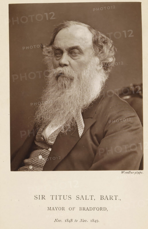 Sir Titus Salt, Bart, Portrait of Sir Titus Salt, page, photomechanical print, inscription: 'Nov. 1848 to Nov. 1849.', photographer: Appleton & Co., Bradford (England), cliché maker: anonymous, c. 1871 - in or before 1881, paper, Woodburytype, height 115 mm x width 91 mm, Person, Titus Salt, historical persons (portraits and scenes from the life) ((full) bust portrait), An older man shown from the chest up in a sepia portrait, facing slightly to his left with a long, full beard and mustache, wavy hair at the sides, pronounced brows, and deep-set eyes, wearing a dark jacket over a patterned vest and shirt, seated against a plain background.