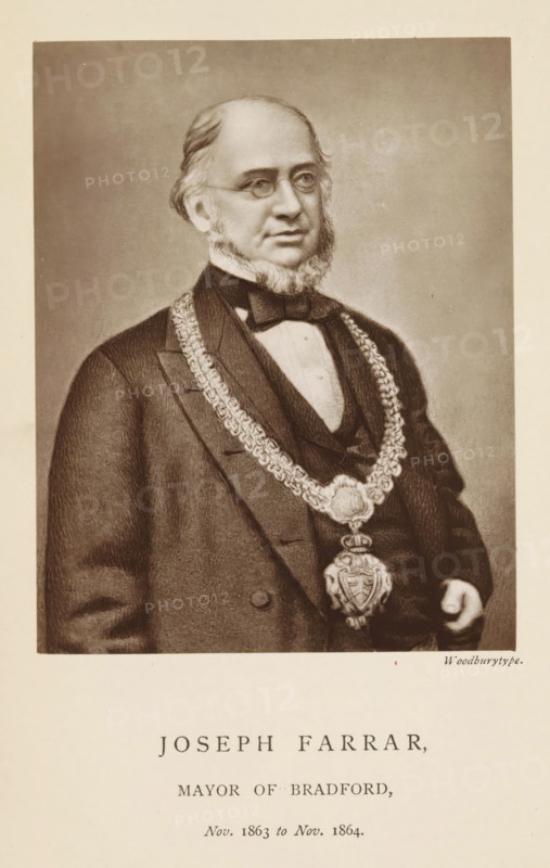 Photo reproduction of a drawing depicting a portrait of Joseph Farrar, Joseph Farrar, mayor of Bradford, reproduction, page, photomechanical print, inscription: 'Nov. 1863 to Nov. 1864.', photographer: Appleton & Co., Bradford (England), cliché maker: anonymous, c. 1871 - in or before 1881, paper, Woodburytype, height 118 mm x width 92 mm, historical persons (portraits and scenes from the life) ((full) bust portrait), A sepia-toned portrait of a middle-aged man shown from the torso up wearing round spectacles and a dark formal coat with a white shirt and bow tie, his hair receding at the temples and sideburns blending into a short beard, a heavy decorative chain with an ornate medallion draped around his neck, one hand partially visible at his side, set against a plain neutral background with a wide light border.