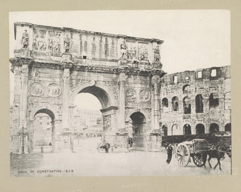 Arch of Constantine, page, photomechanical print, photographer: Samuel J. Beckett, Rome, c. 1890 - c. 1900, paper, collotype, photoprint, height 151 mm x width 202 mm, triumphal arch, A wide stone triumphal arch with ornate relief panels and carved statues sits beside a ruined multi-arched wall; the arch features tall columns, circular medallions, and a large central arched opening flanked by smaller openings, while a horse-drawn cart and a person standing beside it are visible on the roadway in front of the structures.
