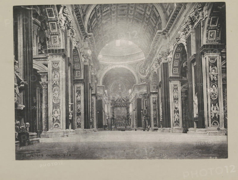 St. Peter's church, page, photomechanical print, photographer: Samuel J. Beckett, St. Peter's Basilica, printmaker: Samuel J. Beckett (possibly), c. 1890 - c. 1900, photographer, Vatican City, paper, collotype, photoprint, height 149 mm x width 202 mm, interior of church, parts of church interior: aisle, A wide interior view of a large ornate church nave with a high vaulted ceiling and a central dome visible toward the rear, flanked by tall decorative columns and pilasters that are richly carved and adorned with sculpted reliefs and framed panels; ornate arches with patterned coffered ceilings line each side and there are multiple statues and sculptural figures positioned on ledges and within niches along the walls; an elaborate altar structure with drapery and a canopy stands beneath the dome, and the floor in the foreground is expansively open and smooth.