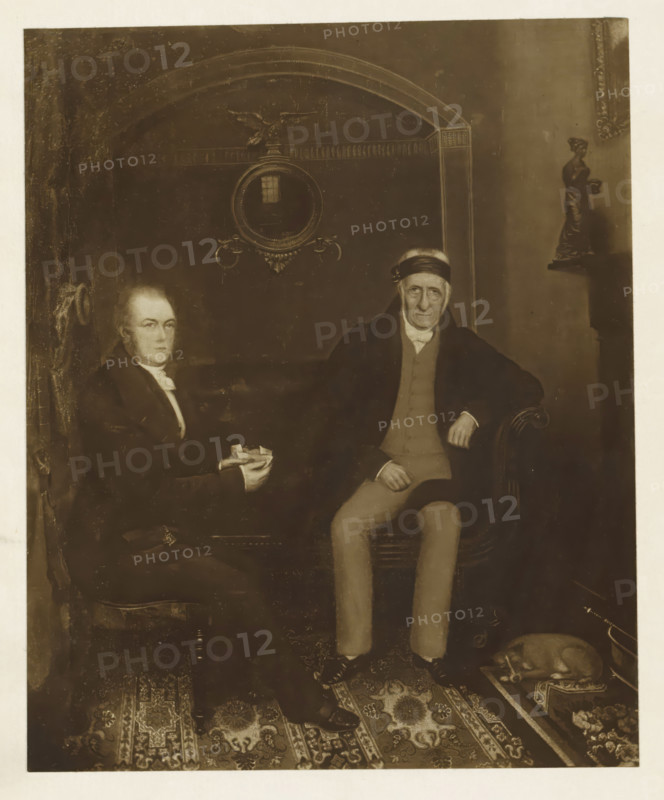 Mr. Dobie and mr. Wilson, photograph, reproduction, page, after painting by anonymous, c. 1886 - in or before 1896, photographer, paper, carbon print, height 155 mm x width 127 mm, Photo on frontispiece., Person, James Dobie (writer), William Wilson, historical persons, interior, representation of a building, A sepia-toned portrait showing two seated men in formal clothing on a patterned carpeted floor, one man on the left holding folded papers and wearing a dark coat and white neckcloth, the other on the right wearing a dark overcoat, light waistcoat, light trousers, and a dark headband, with his hand resting on the arm of an upholstered chair; behind them a wall with decorative molding and a round mirror with an ornate frame and decorative elements above it, and to the right a small statue on a shelf; in the lower right corner a small dog curled up on a cushion beside a metal bucket.