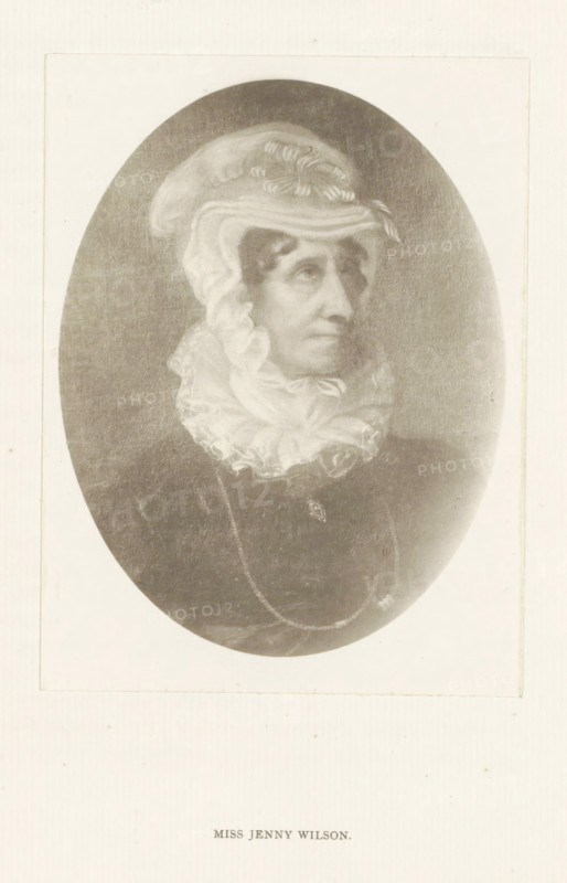 Miss Jenny Wilson, photograph, reproduction, page, after painting by anonymous, c. 1886 - in or before 1896, photographer, paper, platinum process, height 130 mm x width 98 mm, Person, Jenny Wilson, historical persons - BB - woman, An oval portrait of an older woman shown from the shoulders up, wearing a light-colored, ruffled head covering and a high, frilled neckpiece; her face is turned slightly to the side with a neutral expression, and she has pronounced cheekbones and a long nose. Her dark clothing contrasts with the pale fabric around her head and neck, and a delicate chain with a small pendant is visible over the front of her garment. The image is set against a light rectangular background with a narrow border.