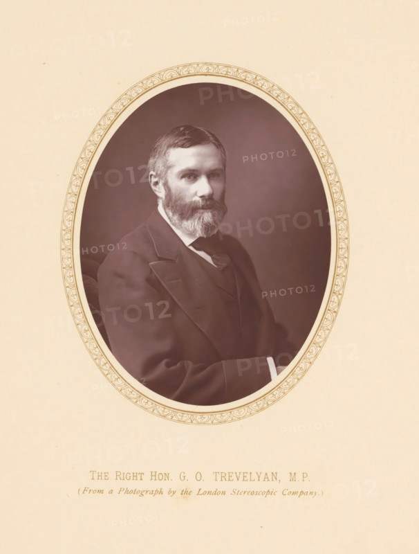 The right hon. GO Trevelyan, MP, page, photomechanical print, photographer: London Stereoscopic Company, London, c. 1875 - c. 1880, printmaker, paper, Woodburytype, Woodburytypie, height 110 mm x width 87 mm, Person, George Trevelyan, politician, eg party leader, An oval-framed sepia portrait of a bearded man wearing a dark suit and tie, set against a plain dark background, with a decorative border around the oval and a light beige surrounding mat.