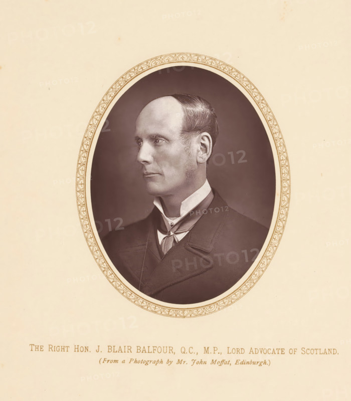 The right hon. J. Blair Balfour, QC, MP, lord advocate of Scotland, page, photomechanical print, photographer: John Moffat, Edinburgh, c. 1875 - c. 1880, printmaker, paper, Woodburytype, height 110 mm x width 87 mm, Person, John Blair Balfour, politician, eg party leader, An oval photographic portrait of a man shown in profile facing left, with a high forehead, short dark hair combed back, sideburns, and a clean-shaven jaw; he is wearing a dark suit jacket, a high white collar, and a cravat tied at the neck; the photograph is set against a dark oval background and surrounded by a narrow decorative oval border on a light beige mount.