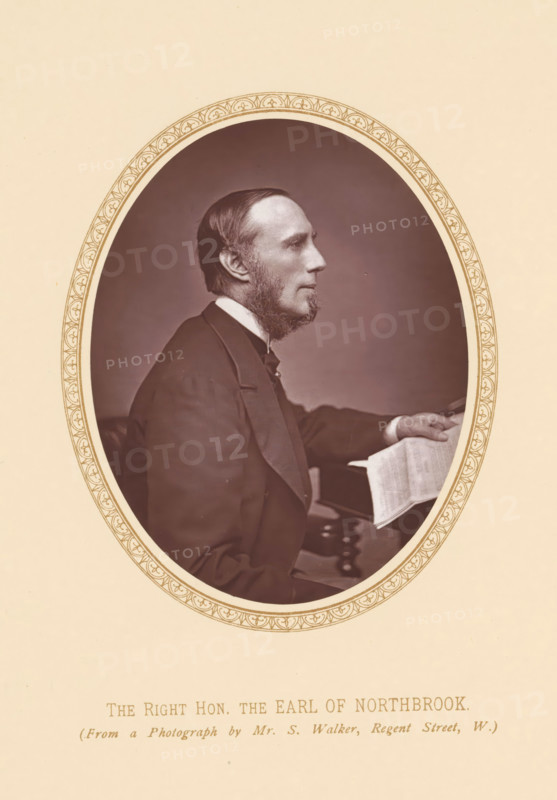 Portrait of Thomas Baring, The right hon. the Earl of Northbrook, page, photomechanical print, photographer: Samuel Alexander Walker, London, c. 1877 - c. 1882, printmaker, paper, Woodburytype, height 110 mm x width 86 mm, Person, Thomas George Baring (1st Earl of Northbrook), politician, eg party leader, An oval sepia-toned portrait shows a bearded man in profile facing right, wearing a dark suit jacket and a white collar, seated with one arm resting on a surface and a hand holding a folded sheet; the portrait is set within a decorative oval border on a pale background.