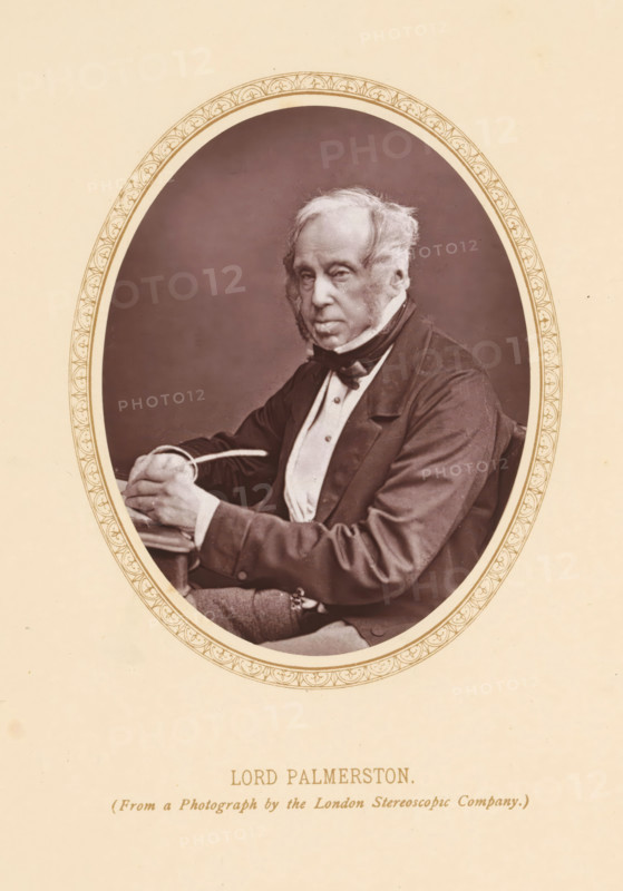 Lord Palmerston, Portrait of Henry John Temple, page, photomechanical print, photographer: London Stereoscopic Company, London, c. 1877 - c. 1882, printmaker, paper, Woodburytype, height 110 mm x width 86 mm, Person, Henry John Temple (3rd Viscount Palmerston), politician, eg party leader, An oval sepia photograph framed by a decorative border shows an older man seated in three-quarter view wearing a dark jacket, light waistcoat, white shirt, and a dark necktie; he has sideburns and thinning hair, and his hands rest on a surface holding a slim object.